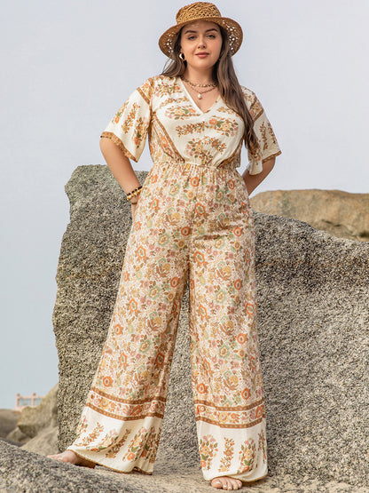 Plus Size V-Neck Flutter Sleeve Wide Leg Jumpsuit - UrbanEthereal